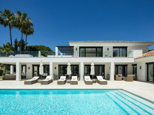 Get Your Luxury Golf Villa in Nueva Andalucía, Marbella A stunning luxury villa located in the prestigious Nueva Andalucía area, offering an exceptional real estate opportunity in Marbella's most desirable location. Key Features 5 bedrooms 5 bathrooms + 1 guest toilet 490 m² built area 1,561 m² plot size Private swimming pool Private garden Frontline golf position Recently renovated with premium finishes Entertainment level with bar Fully equipped home gym Expansive windows with natural light Covered carport for two cars Investment Advantages Prime location in Nueva Andalucía Exceptional renovation quality High-end amenities Potential for luxury rental market Impressive golf course views Pricing Sale Price just: €6,950,000 Exclusive of additional taxes and fees Location Highlights Heart of Nueva Andalucía Easy access to local amenities Stunning golf course panoramas Close to Marbella's premium services A perfect blend of luxury, design, and prime location, this Luxury Golf Villa represents an outstanding investment in Marbella's luxury real estate market.