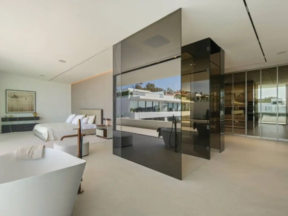 Primary bathroom in Villa 12 featuring marble finishes and bespoke cabinetry.