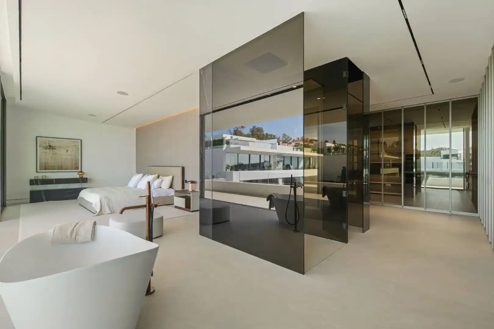 Primary bathroom in Villa 12 featuring marble finishes and bespoke cabinetry.