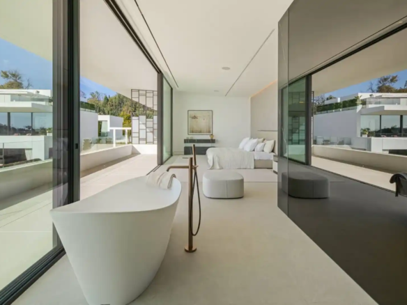Primary bathroom in Villa 12 featuring marble finishes and bespoke cabinetry.