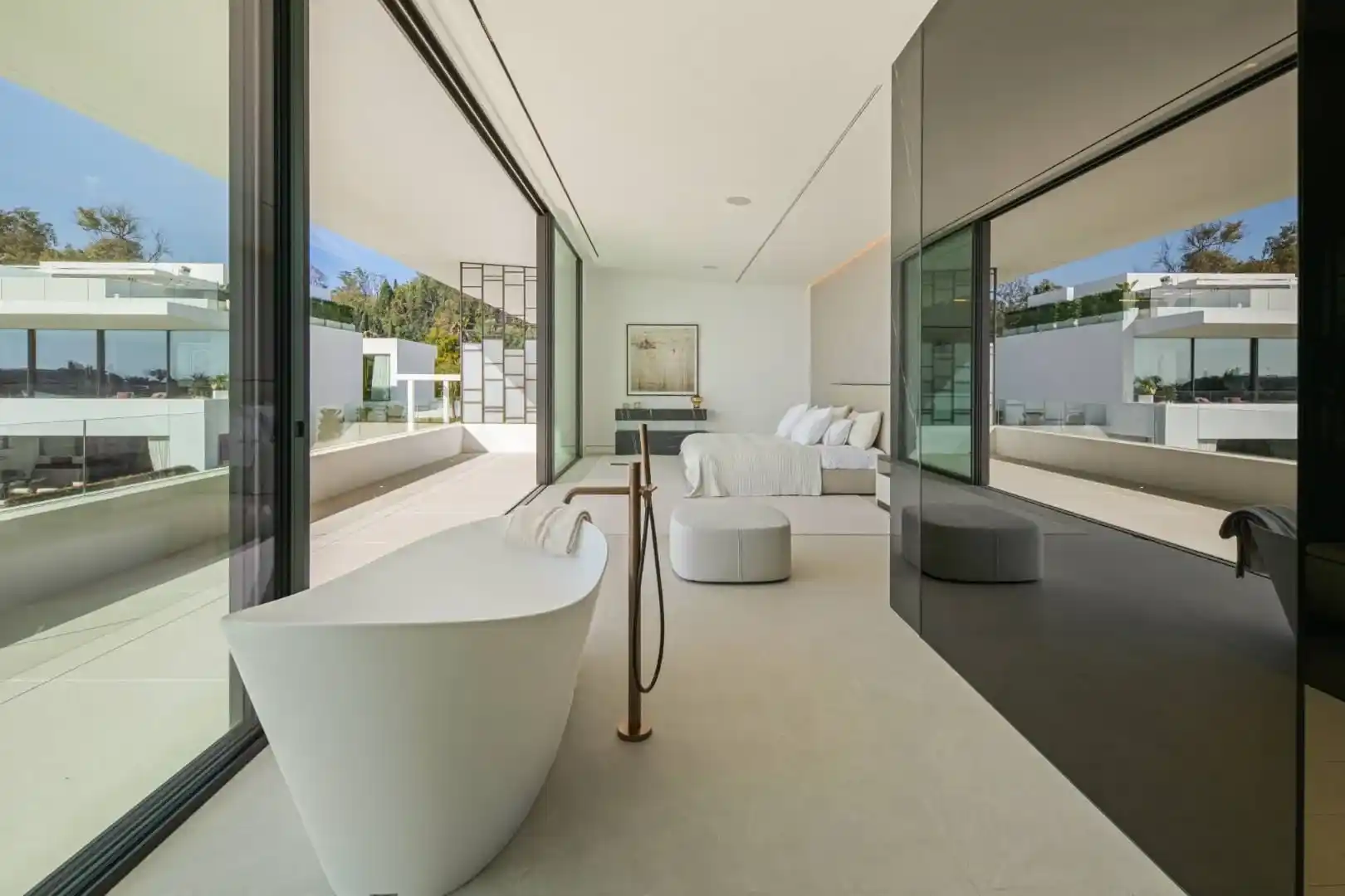Primary bathroom in Villa 12 featuring marble finishes and bespoke cabinetry.