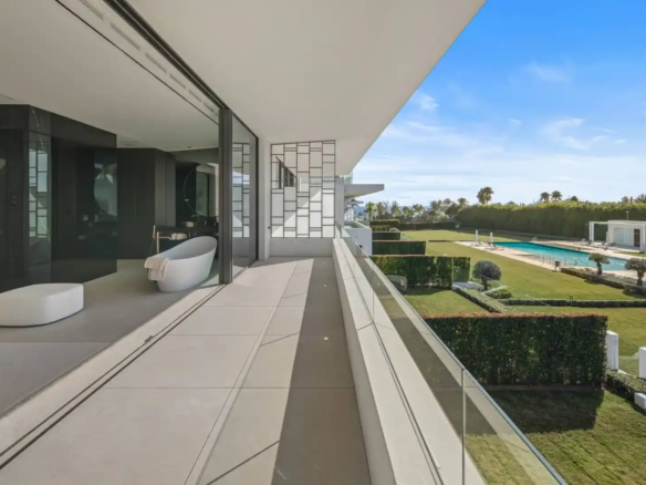 Primary bathroom in Villa 12 featuring marble finishes and bespoke cabinetry.