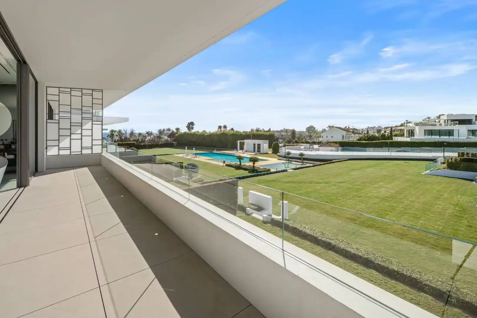 Primary bathroom in Villa 12 featuring marble finishes and bespoke cabinetry.